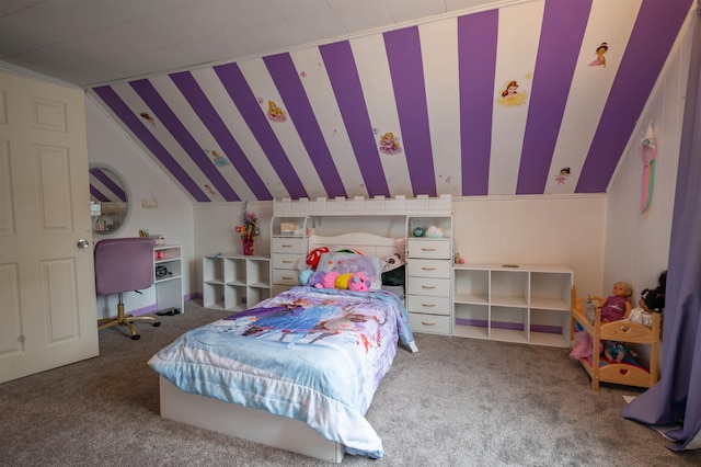 carpeted bedroom with lofted ceiling