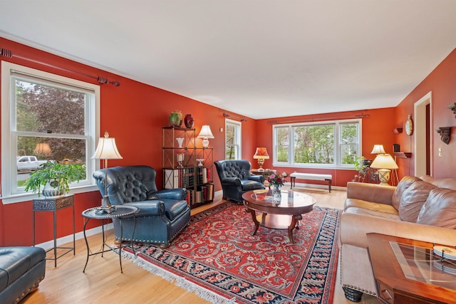 living area with wood finished floors and baseboards