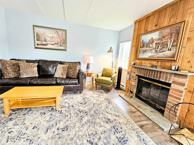 5A Mountain Vlg, Dover, VT 05356 - living room featuring wood finished floors, a brick fireplace, and wooden walls