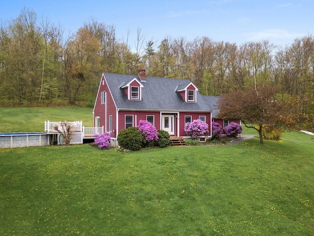 898 Old Airport Rd, Monkton, VT 05443 - cape cod home featuring a chimney, a front yard, a deck, and an outdoor pool