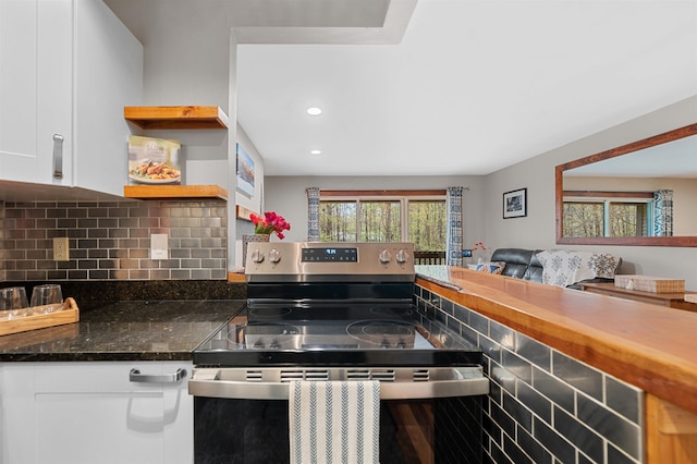 kitchen with electric stove, backsplash, white cabinetry, recessed lighting, and open shelves