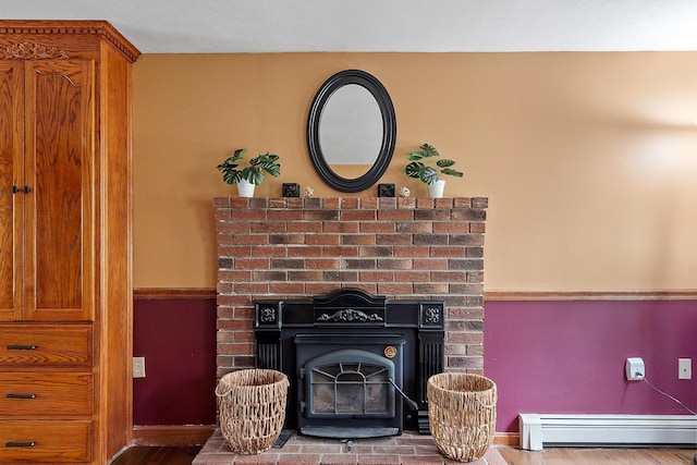 detailed view of baseboard heating and wood finished floors