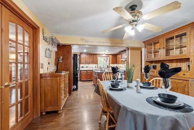 dining room featuring light wood finished floors and a ceiling fan
