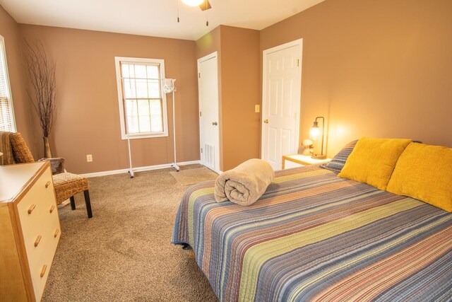 43 Parker Ledge Rd, Woodstock, NH 03262 - bedroom featuring light carpet, baseboards, and a ceiling fan