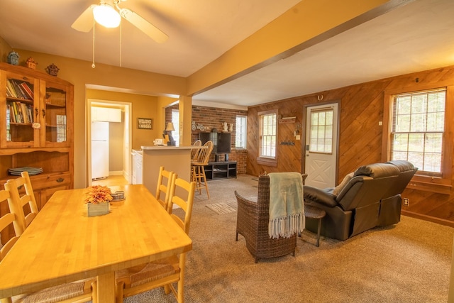 43 Parker Ledge Rd, Woodstock, NH 03262 - dining area featuring carpet, ceiling fan, and wood walls