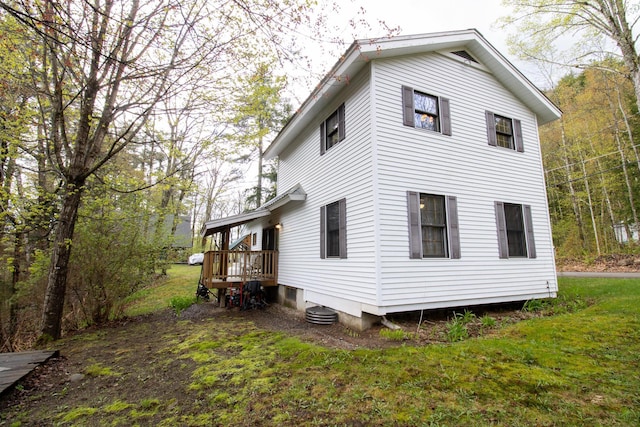 43 Parker Ledge Rd, Woodstock, NH 03262 - rear view of house with a lawn