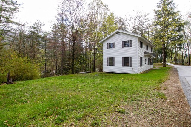 43 Parker Ledge Rd, Woodstock, NH 03262 - view of home's exterior with a lawn