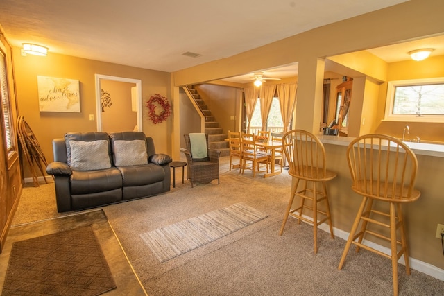 43 Parker Ledge Rd, Woodstock, NH 03262 - carpeted living room with stairs, healthy amount of natural light, baseboards, and bar with sink