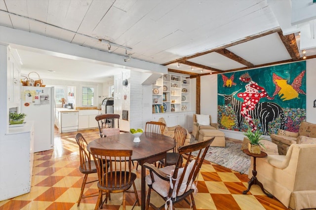 144 Parsons Rd, Dublin, NH 03444 - dining space with light floors, built in shelves, rail lighting, and beamed ceiling