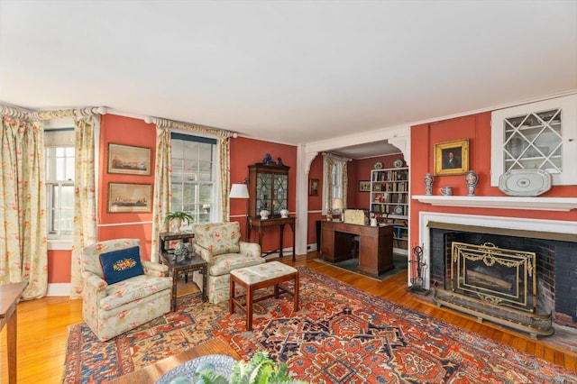 144 Parsons Rd, Dublin, NH 03444 - living area with wood finished floors, a fireplace with flush hearth, ornamental molding, and baseboards