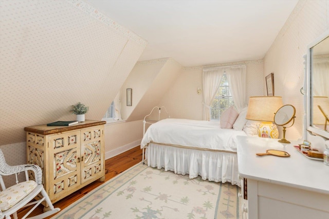 144 Parsons Rd, Dublin, NH 03444 - bedroom with wood finished floors, wallpapered walls, and lofted ceiling