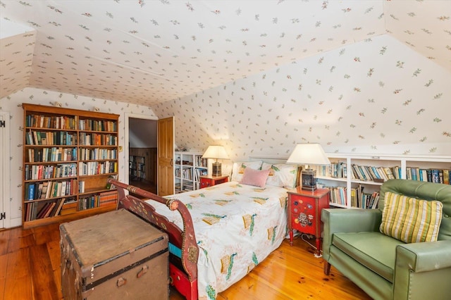 144 Parsons Rd, Dublin, NH 03444 - bedroom with wallpapered walls, vaulted ceiling, and hardwood / wood-style flooring