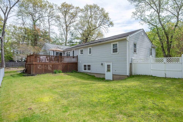 back of property featuring a wooden deck