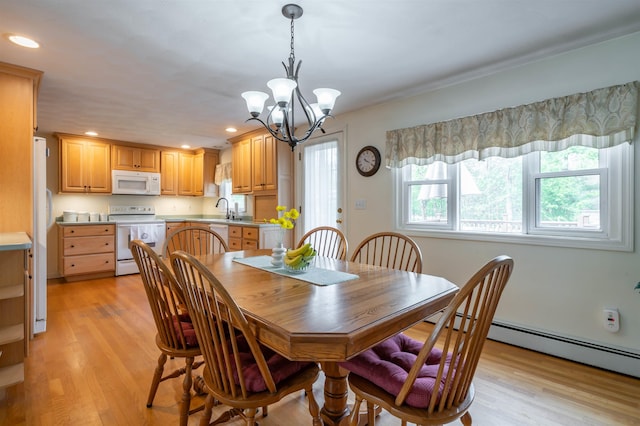 dining space featuring a chandelier, light wood-style floors, recessed lighting, and a baseboard heating unit