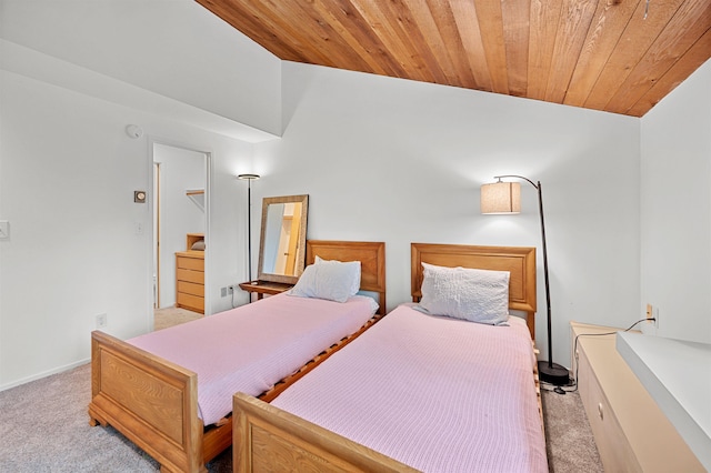 carpeted bedroom with wood ceiling and baseboards