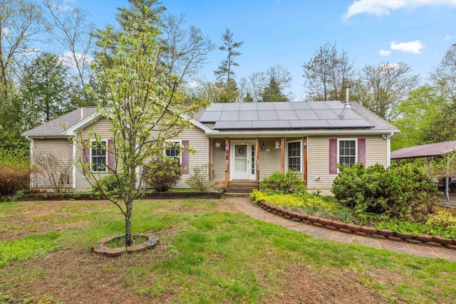 56 Call Rd, Webster, NH 03303 - ranch-style house with solar panels, a front lawn, and a shingled roof