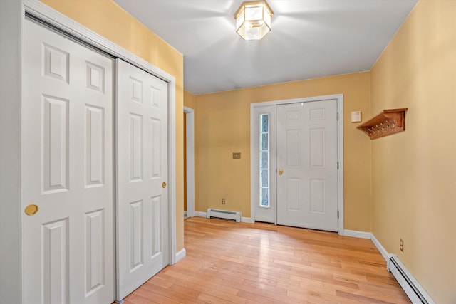 56 Call Rd, Webster, NH 03303 - foyer featuring a baseboard radiator, light wood-type flooring, and baseboards