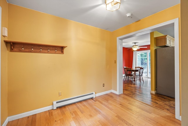 56 Call Rd, Webster, NH 03303 - unfurnished room with baseboard heating, light wood finished floors, baseboards, a ceiling fan, and a smoke detector