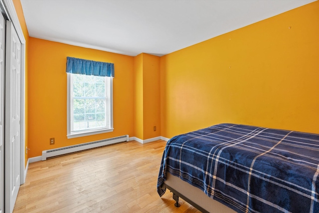 56 Call Rd, Webster, NH 03303 - bedroom featuring a baseboard radiator, wood finished floors, and baseboards