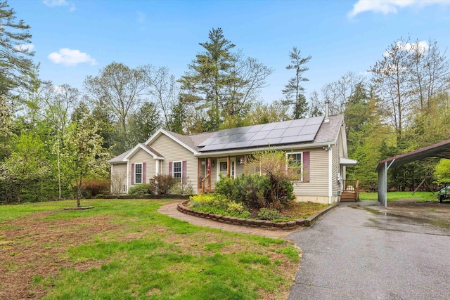 56 Call Rd, Webster, NH 03303 - ranch-style home with asphalt driveway, a detached carport, solar panels, and a front yard