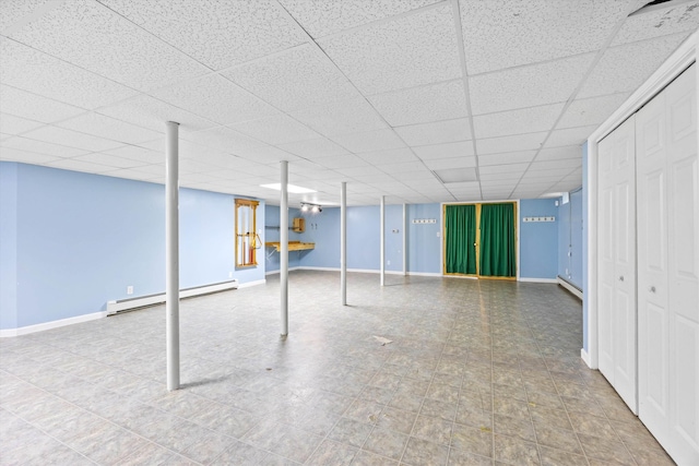 56 Call Rd, Webster, NH 03303 - finished basement with a baseboard heating unit, a drop ceiling, and baseboards