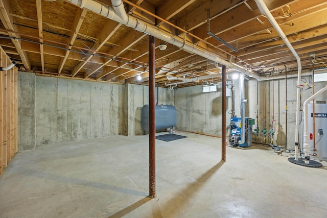 56 Call Rd, Webster, NH 03303 - unfinished below grade area featuring oil tank, a heating unit, and gas water heater