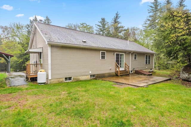 56 Call Rd, Webster, NH 03303 - rear view of house with a lawn, entry steps, a shingled roof, and a patio area