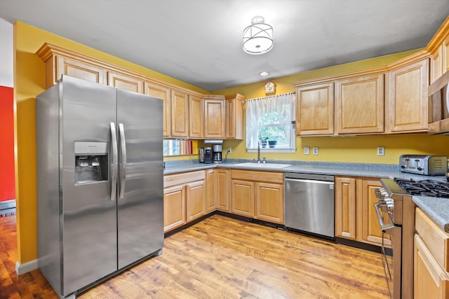 56 Call Rd, Webster, NH 03303 - kitchen with stainless steel appliances, a sink, light wood-type flooring, and light brown cabinetry