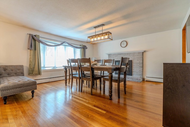 1 Alpine Rd, Windham, NH 03087 - dining space with a baseboard radiator and light wood-type flooring