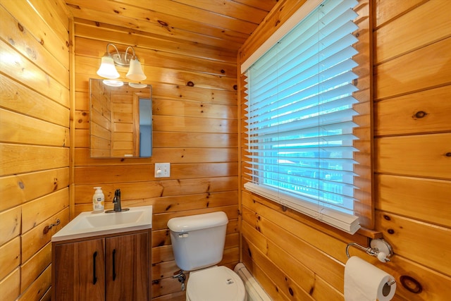 1 Alpine Rd, Windham, NH 03087 - bathroom with toilet, wooden walls, and vanity
