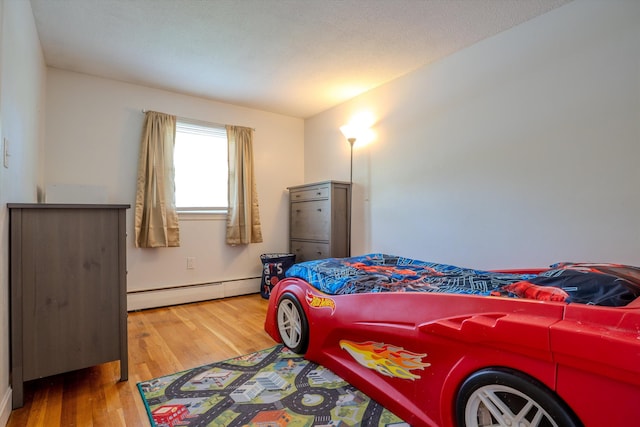 1 Alpine Rd, Windham, NH 03087 - bedroom with baseboard heating, wood finished floors, and baseboards