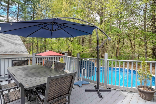 1 Alpine Rd, Windham, NH 03087 - deck featuring an outdoor pool, outdoor dining space, and a view of trees