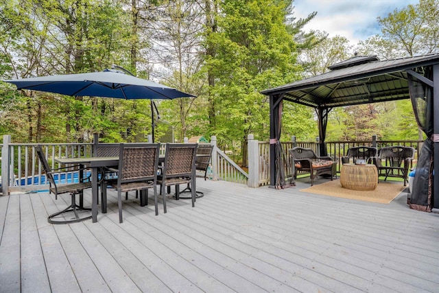 1 Alpine Rd, Windham, NH 03087 - deck featuring outdoor dining area, a gazebo, and view of scattered trees