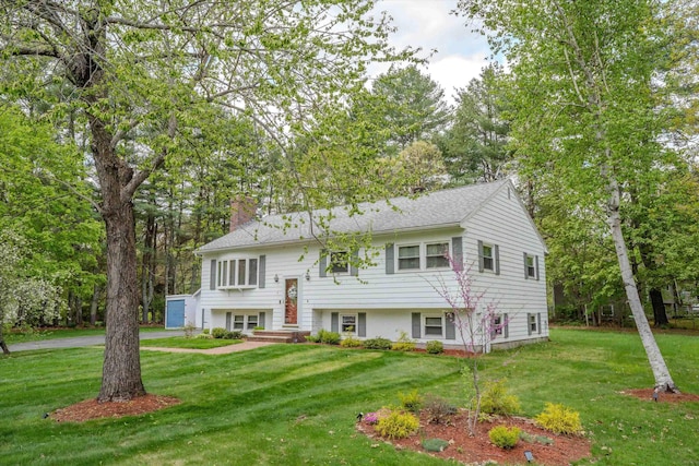 1 Alpine Rd, Windham, NH 03087 - raised ranch with a chimney, a garage, a front yard, and driveway