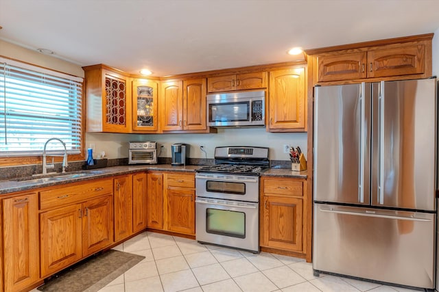 1 Alpine Rd, Windham, NH 03087 - kitchen with stainless steel appliances, a sink, brown cabinetry, glass insert cabinets, and recessed lighting