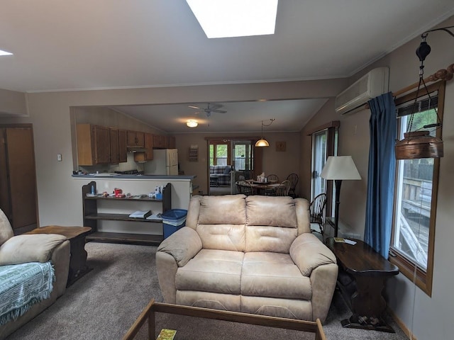 carpeted living area featuring a wall mounted AC, crown molding, ceiling fan, and a skylight