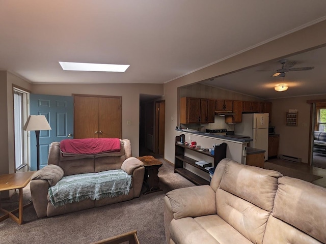 carpeted living room with a baseboard heating unit, a skylight, and ornamental molding