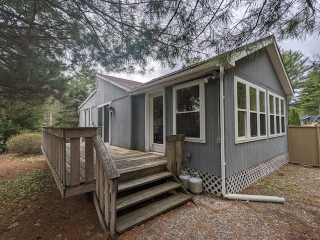 view of side of home featuring a wooden deck