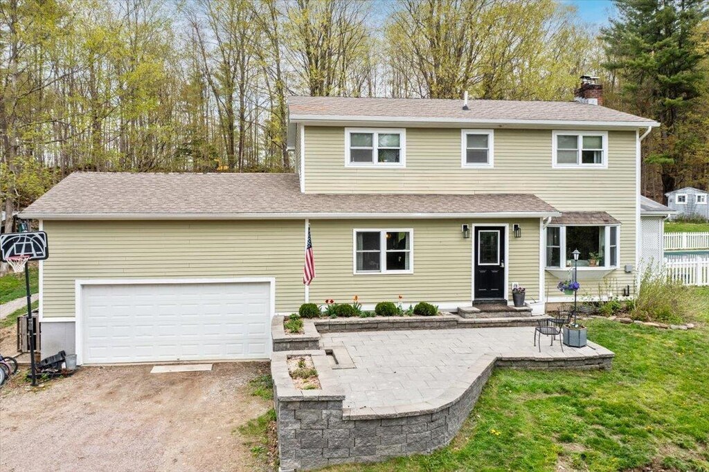 70 Petty Brook Rd, Milton, VT 05468 - traditional-style home featuring a chimney, driveway, and a garage