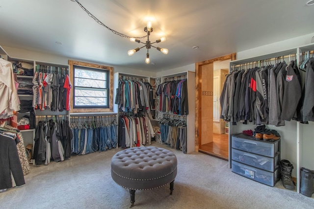 7206 S Wheelock Rd, Wheelock, VT 05851 - walk in closet featuring carpet and a chandelier