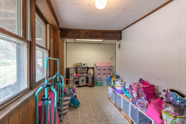 7206 S Wheelock Rd, Wheelock, VT 05851 - game room featuring healthy amount of natural light, tile patterned floors, and wooden walls