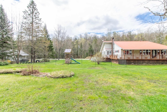 7206 S Wheelock Rd, Wheelock, VT 05851 - view of grassy yard featuring a playground and a wooden deck