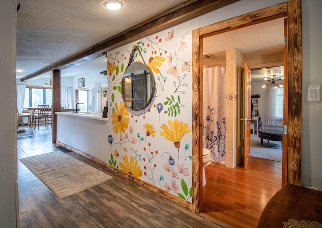 7206 S Wheelock Rd, Wheelock, VT 05851 - hallway featuring a textured ceiling and wood finished floors