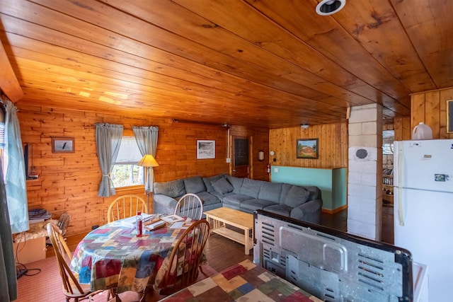 living area with wooden ceiling, wood walls, and wood finished floors