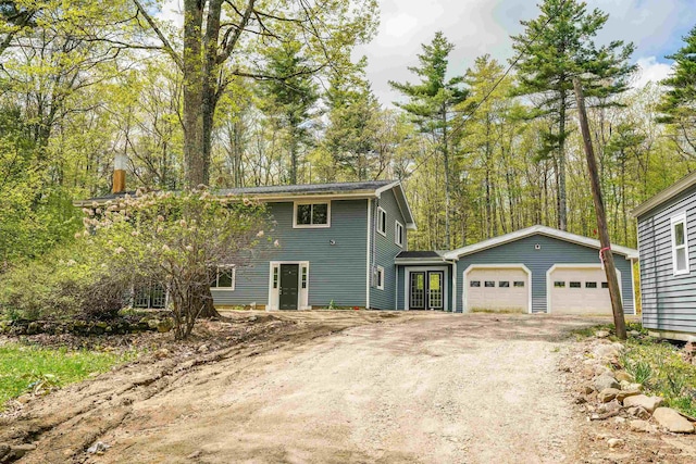view of home's exterior with a garage and driveway