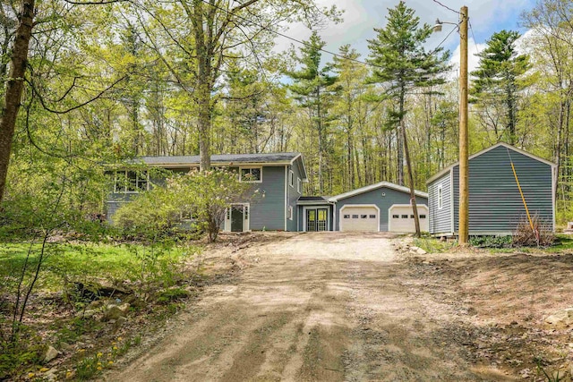 view of front of home with driveway and an attached garage