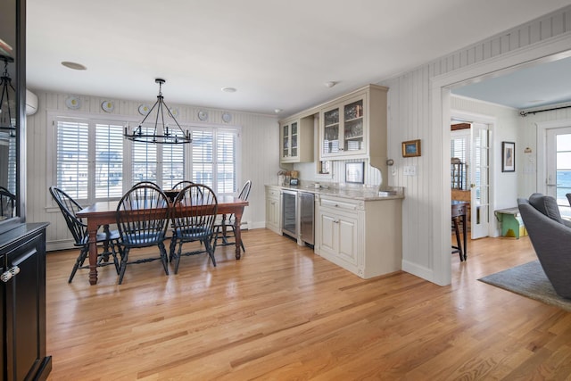 150 Webhannet Dr, Wells, ME 04090 - kitchen featuring wine cooler, glass insert cabinets, a chandelier, and healthy amount of natural light