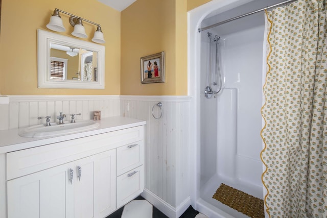 150 Webhannet Dr, Wells, ME 04090 - full bathroom with wainscoting, a shower with curtain, and vanity