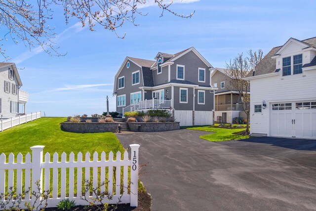 150 Webhannet Dr, Wells, ME 04090 - view of front of house featuring a garage and a residential view