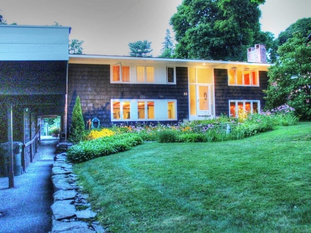 52 Cliff St, Burlington, VT 05401 - back of property featuring a lawn and a chimney